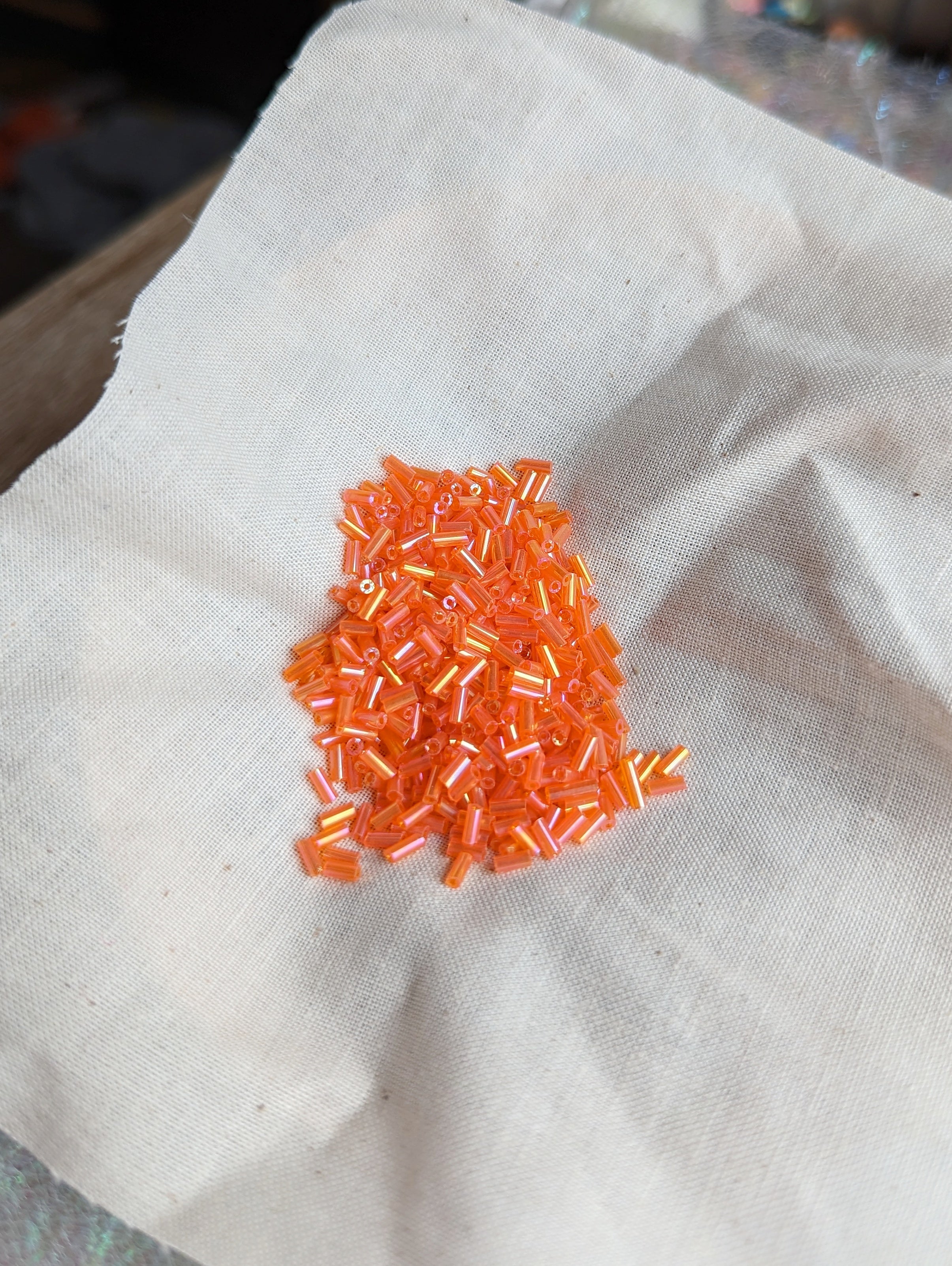 2.7mm Sunset Orange Bugle Beads 12g